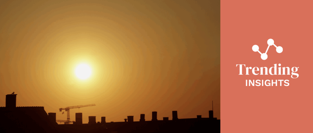 Early morning summer sun over cityscape 