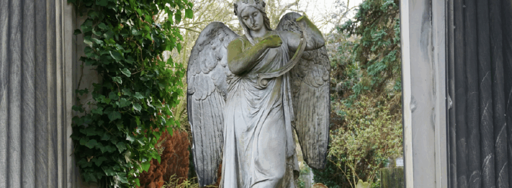 woman in dress statue near black metal fence woman in dress statue near black metal fence