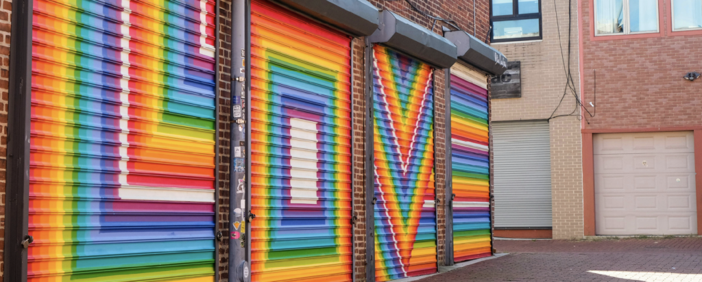 Rainbow colored LOVE on roll up doors 