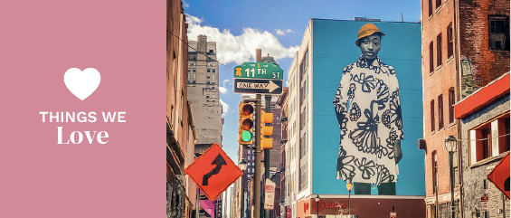 a large mural of a person on the side of a building a large mural of a person on the side of a building