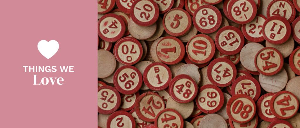 old wooden bingo markers with red type