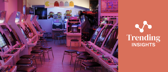 turned-on arcade machines with stools